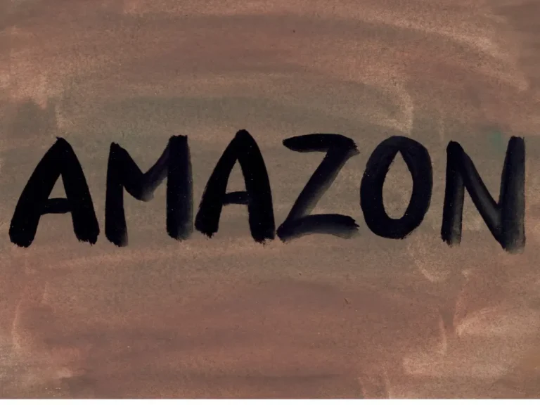The word AMAZON hand-painted in black on a brown textured background