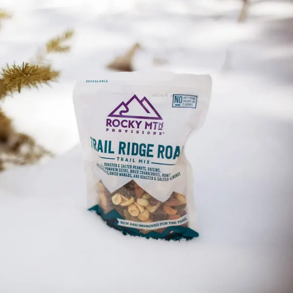 Bag of Rocky Mtn Trail Ridge Road trail mix standing in fresh snow